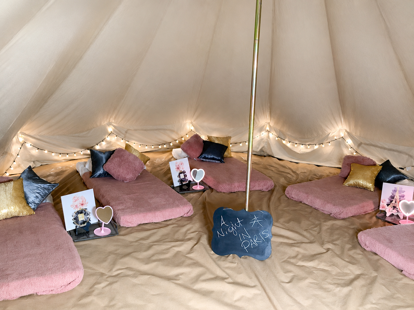 Pretty in Pink sleepover setup inside the Glamp Camp bell tent